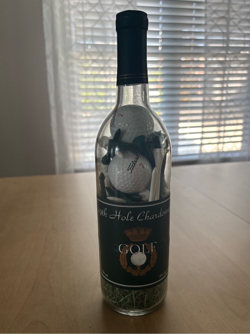 19Th Hole Chardonnay Wine Bottle. Contains 3 Titleist Golf Balls & several Tees